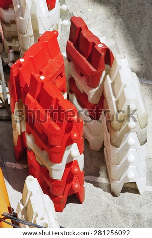 plastic barriers blocks  red and white  in the city street
