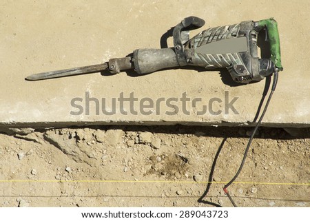 pneumatic hammer drill equipment to repair the pipes from the street  city