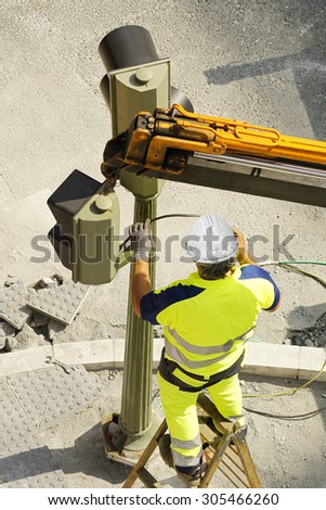 electrician utility service worker  company to repair traffic lights in the street city