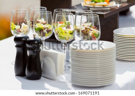 catering weddings table with glasses and plates