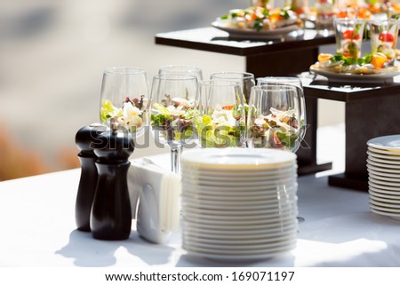 catering weddings table with glasses and plates