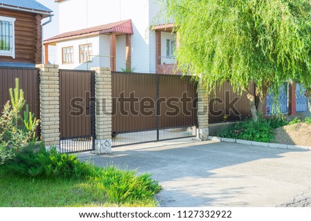 Brown automatic gates in the cottage
