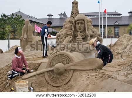 KAGOSHIMA, JAPAN - APRIL 30: Artists work on a sand sculpture of Charles Lindbergh in his  airplane at the Fukiage Sand sculpture  festival April 30, 2007 in Kagoshima, Japan.