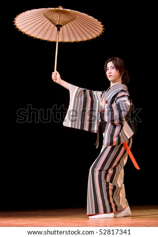 KAGOSHIMA CITY, JAPAN - OCTOBER 25:  A participant in the Taniyama Furusato Matsuri wears kimono  and dance while carrying an umbrella October 25, 2008 in Kagoshima City, Japan.