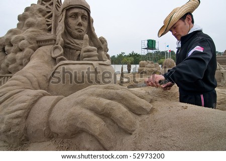KAGOSHIMA, JAPAN - APRIL 30: An artist work on a sand sculpture of Charles Lindbergh in his airplane at the Fukiage Sand sculpture festival April 30, 2007 in Kagoshima, Japan.