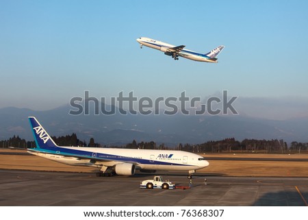 KAGOSHIMA, JAPAN - FEBRUARY 18: Recently active Shinmoedake volcano erupts as  ANA jet takes off from Kagoshima Airport,  February 18, 2011 in Kagoshima, Japan. Volcanic ash has disrupted air traffic.