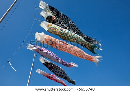 Japanese koi carp wind socks blow in the wind.  In Japan these are flown by the families of male children in the weeks before and after the May 5th Children\'s Day holiday.