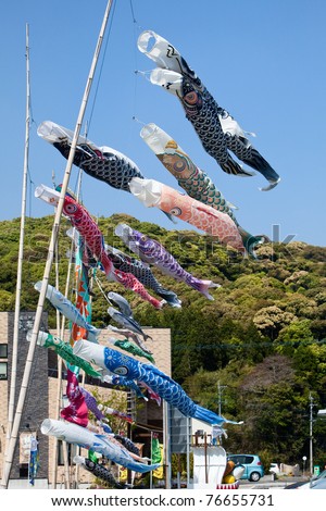 Japanese koi carp wind socks blow in the wind. In Japan these are flown by the families of male children in the weeks before and after the May 5th Children\'s Day holiday.