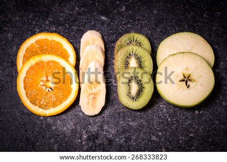 Fruits on black stone