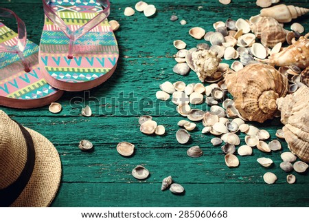 Shells on old wooden table,Summer holiday concept, vintage style. Good for season sale card,summer travel card,for tourism advertisement.