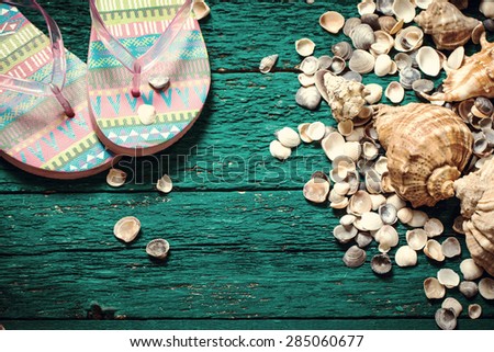 Shells on old wooden table,Summer holiday concept, vintage style. Good for season sale card,summer travel card,for tourism advertisement.