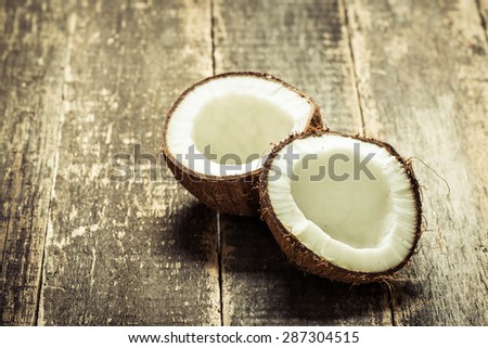 Coconut on wooden table.Vintage filter. Organic healthy food concept.Beauty and SPA concept.