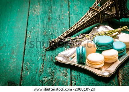fresh macaroons on wooden table .Vintage filter