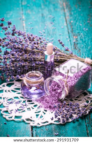 lavender flower,oil,salt, spa beauty concept. wood old background.