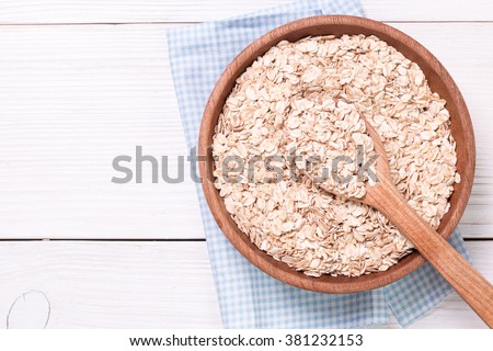 oat flakes on wooden table.healthy food concept.