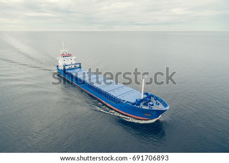 Aerial view of general cargo ship in open sea