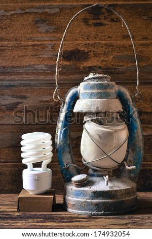 fluorescent lamp and old lantern vintage on the wooden