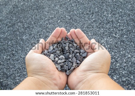 crushed stone in hand