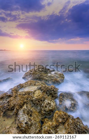 the gentle sun falling in the warm waters of summer sea