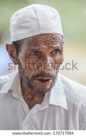 KERALA,INDIA - NOVEMBER 27 : An unidentified muslim man wearing muslim cap at local market on November 27, 2011 in Kerala, India