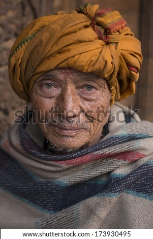 PATAN, NEPAL - MARCH 23: Unidentified Nepali old man poses for camera in Patan, Nepal on March 23, 2013.