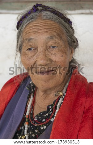 POKHARA, NEPAL - MARCH 28 : Unidentified Tibetan woman portrait in Pokhara, Nepal on March 28, 2013.