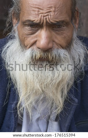 PATAN, NEPAL - MARCH 23: Unidentified Nepali old man poses for camera in Patan, Nepal on March 23, 2013.