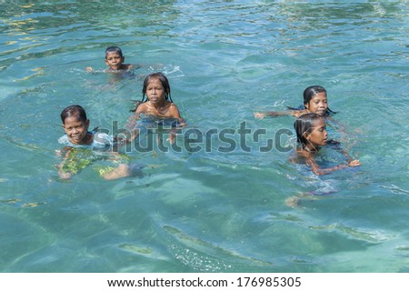 OMADAL ISLAND, SABAH, MALAYSIA - JANUARY 28 : Unidentified Sea Gypsies people on January 28, 2012 in Sabah, Malaysia. The Sea Gypsies are sea nomads that move from one place to another.