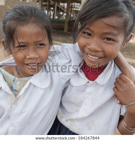 KAMPONG PHLUK,CAMBODIA-DEC 24:Portrait of an unidentified Khmer girls on Tonle Sap Lake in Kampong Phluk,Cambodia on December 24,2011.It is the largest lake in Southeast Asia (up to 16,000 square km).