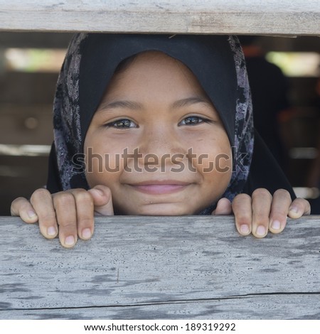 TERENGGANU, MALAYSIA - APRIL 9, 2014: Portrait of an unidentified Malay ethnic  in Terengganu, Malaysia. The Malays, make up Malaysia\'s largest ethnic group, which is more than 50% of the population.