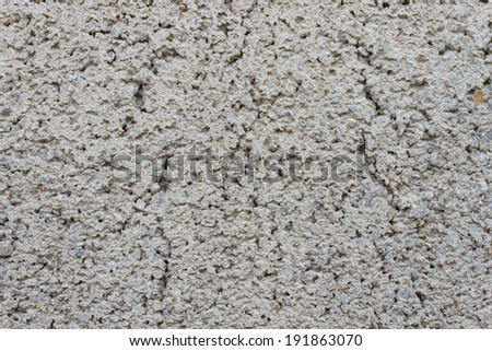 White rugged cement background that consist of small sand and stone. Concrete texture for grunge or old design