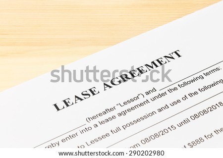 Lease Agreement Contract Document on Wood Table. Legal document for business event