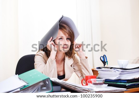 Upset stressed young woman at  work