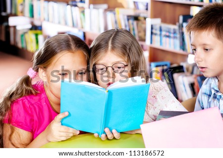 Intelligent kids reading a book