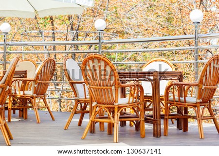 Stylish tables and chairs in an open air cafe terrace