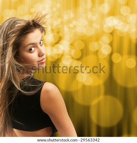 Attractive girl turning her head, hair flying away