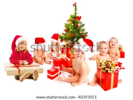 stock-photo-group-of-santa-kids-sitting-beside-christmas-tree-40393051.jpg