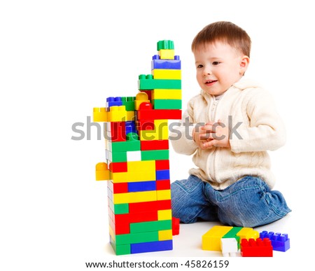 Toddler building a tower, isolated