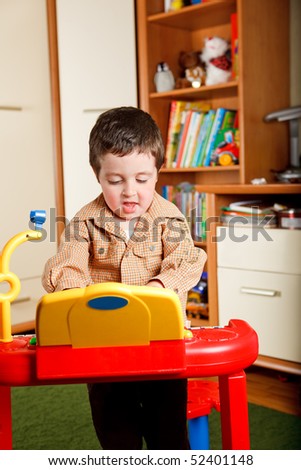 Boy playing toy piano