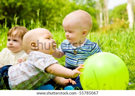 stock photo : Babies playing with ball in the outdoor