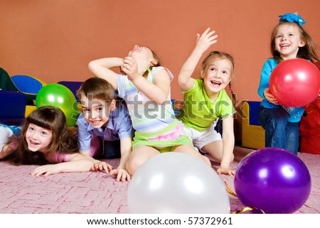 Happy preschool kids playing with balloons Happy preschool kids playing with balloons