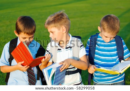 Kids with books  in park