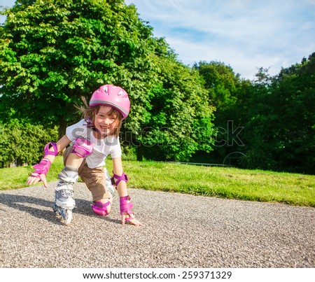 Kid in pink protective sportswear
