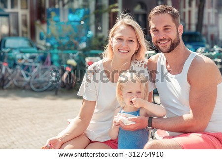 Portrait of a happy family enjoying morning in Amsterdam, capital of the Netherlands