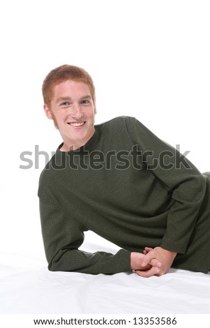stock photo : Attractive teenage boy with red hair, freckles, and sideburns.