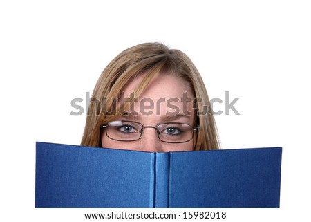 pretty young woman peeking over top of blue book