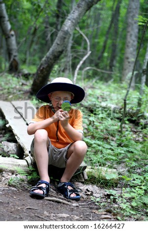 Looking Through Glass. young boy looking through