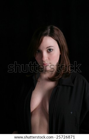 beautiful young woman with her shirt open, sensually exposing her breasts