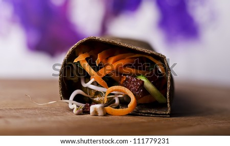 raw food wrap with vegan ingredrients and green pesto