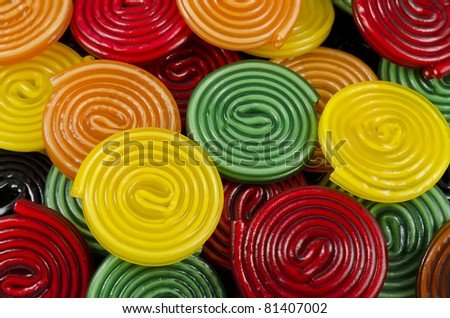 colorful licorice candy wheels as background